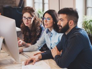 A senior software engineer collaborating with a team, writing code, and leading complex projects to drive innovation and development in the tech industry.