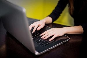 A working woman juggling career responsibilities and personal life, focusing on strategies to maintain work-life balance while advancing in her career and personal goals.