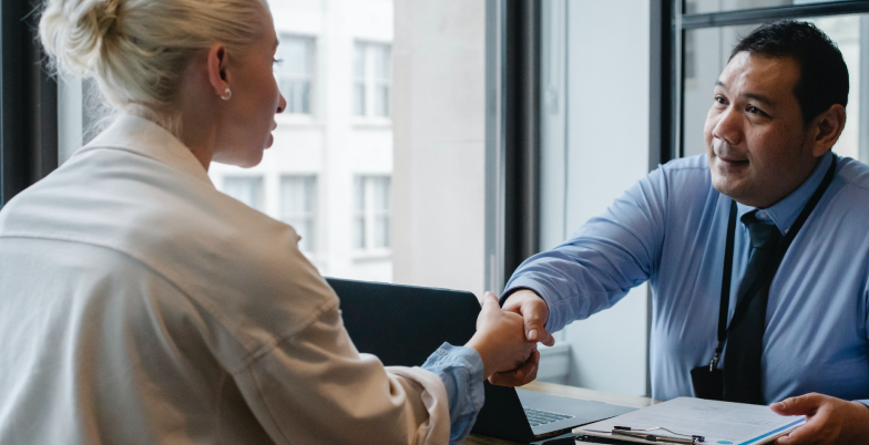 A person preparing for a job interview, practicing responses, and reviewing resume to boost confidence and improve chances of success in interviews.