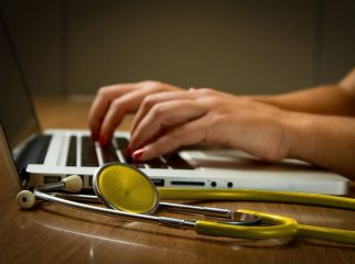 A healthcare professional using identity management systems to secure sensitive patient data, ensuring privacy and compliance within the healthcare industry.