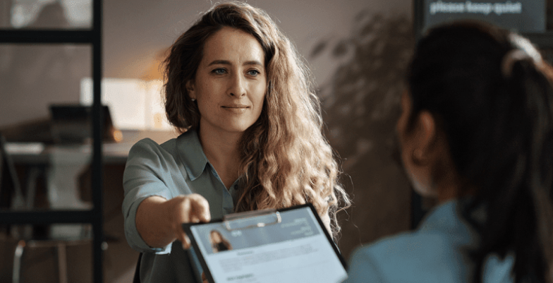 A person writing or editing their resume, focusing on key sections like skills, experience, and achievements to create a standout document for job applications.