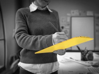 A person crafting a detailed job description, highlighting key responsibilities, required skills, and qualifications to attract top talent and ensure role clarity.